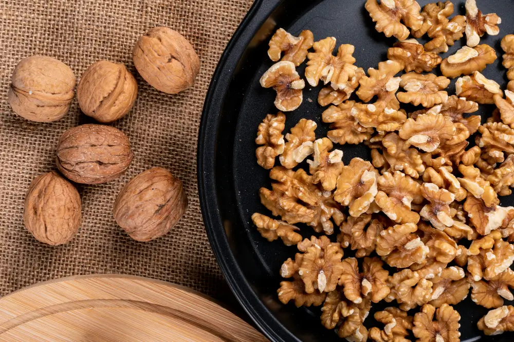 Walnut halves sprinkled over oatmeal, a simple way to add walnuts to breakfast